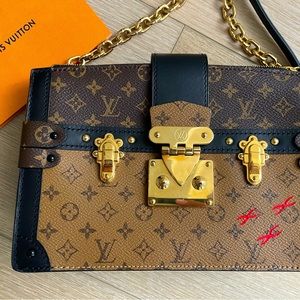 Authentic Louis Vuitton Trunk Clutch Mng M Rev M43596 excellent condition!!